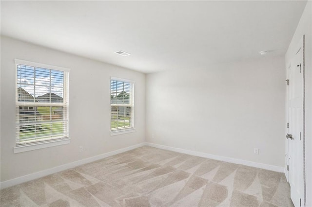 view of carpeted spare room