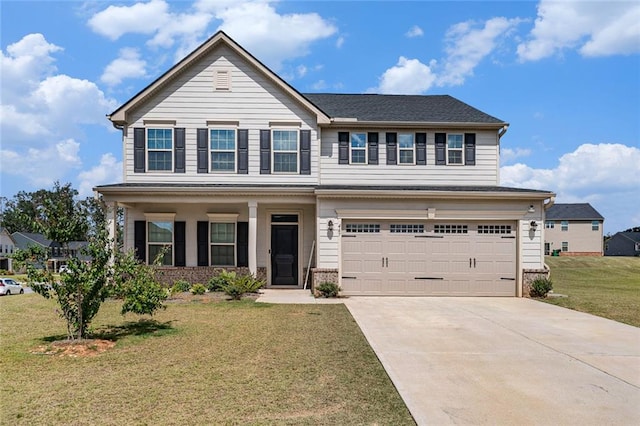 view of front of property with a garage and a front lawn