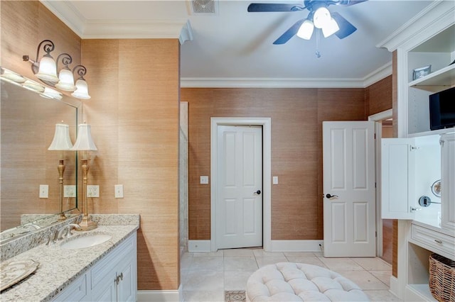 bathroom featuring ceiling fan, tile patterned flooring, vanity, and ornamental molding