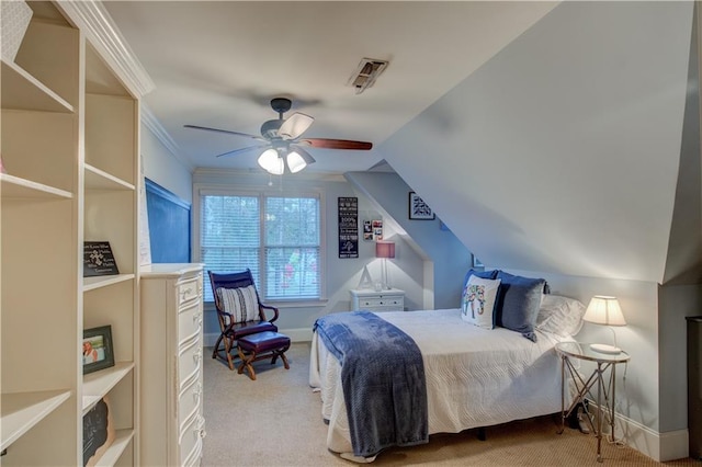 carpeted bedroom featuring lofted ceiling, ceiling fan, and crown molding