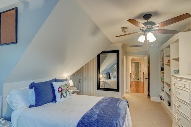 carpeted bedroom with ceiling fan, a closet, and lofted ceiling