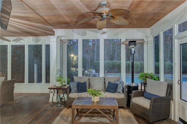 sunroom / solarium with ceiling fan and wooden ceiling