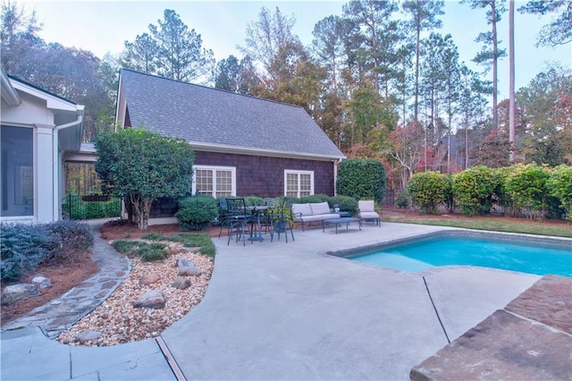 view of swimming pool with outdoor lounge area and a patio area