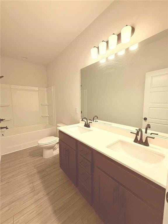 1923 Westfall Lndg, Auburn, GA 30011 - bathroom featuring double vanity, wood finished floors, and washtub / shower combination