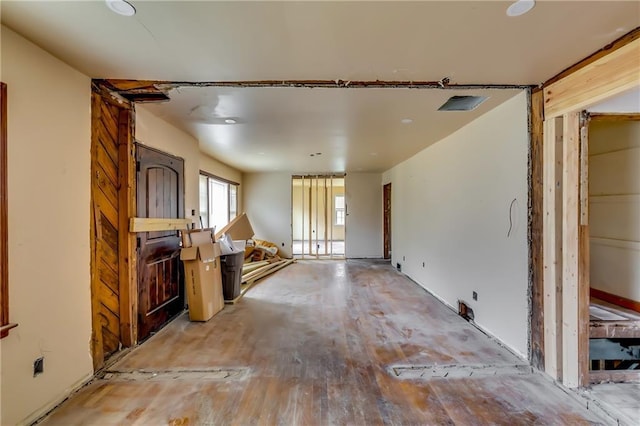 unfurnished living room featuring wood-type flooring