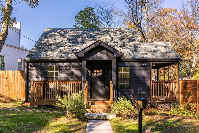 bungalow-style house with a front lawn