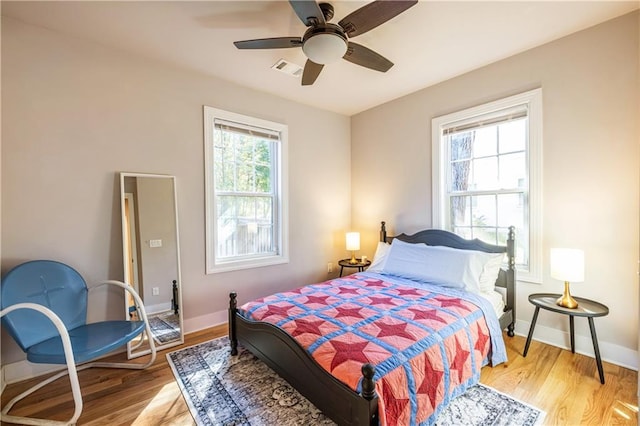 bedroom featuring ceiling fan and light hardwood / wood-style floors