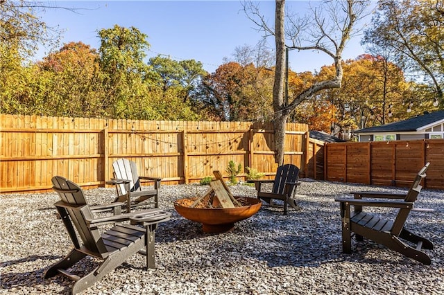 view of patio with an outdoor fire pit