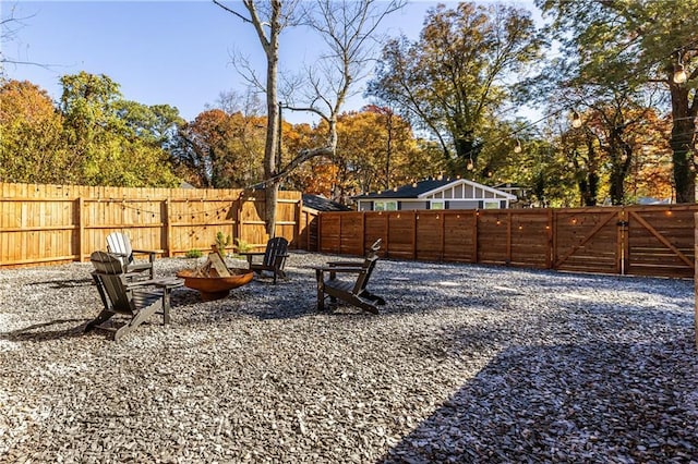 view of yard with an outdoor fire pit