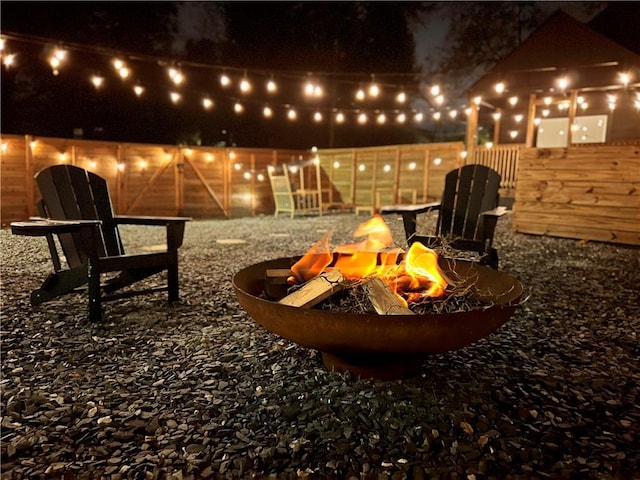 patio at night with an outdoor fire pit