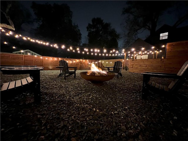 patio at night with an outdoor fire pit