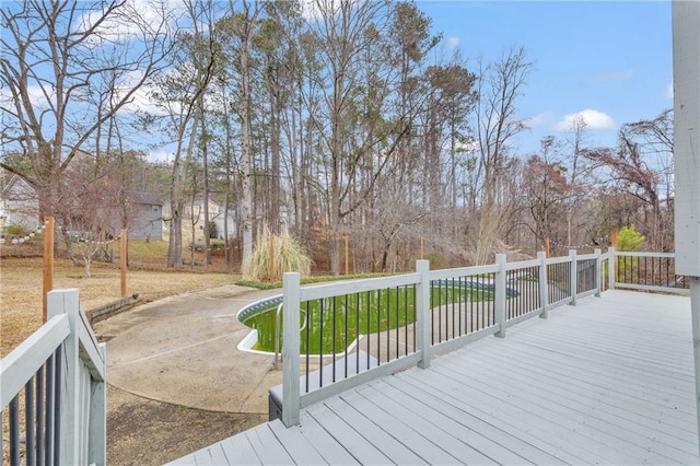 deck with a patio area and a lawn