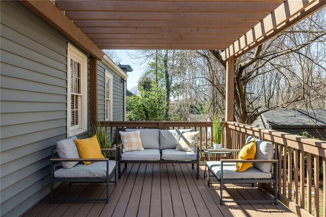 wooden terrace featuring outdoor lounge area