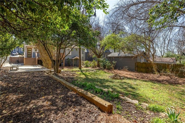 view of yard with entry steps and fence