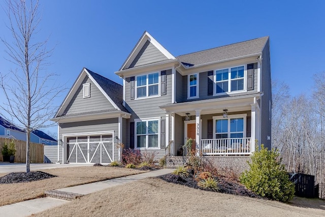 view of front of home featuring covered porch and a garage