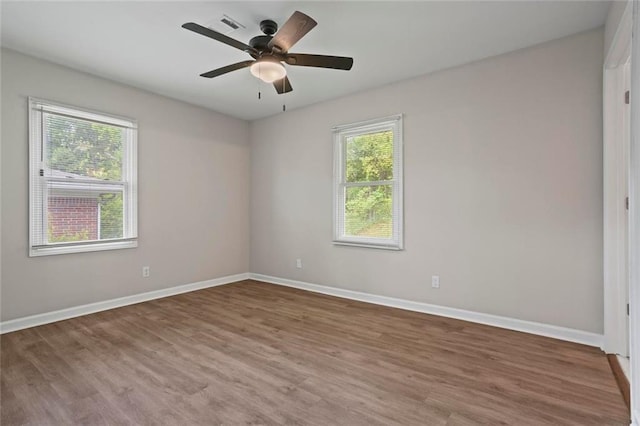 2478 Graywall St, East Point, GA 30344 - spare room with wood finished floors, baseboards, and a ceiling fan