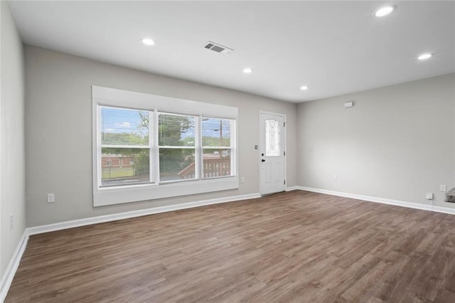 2478 Graywall St, East Point, GA 30344 - unfurnished living room with wood finished floors, recessed lighting, and baseboards