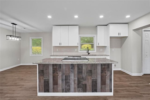 2478 Graywall St, East Point, GA 30344 - kitchen with a sink, baseboards, white cabinetry, a center island, and recessed lighting