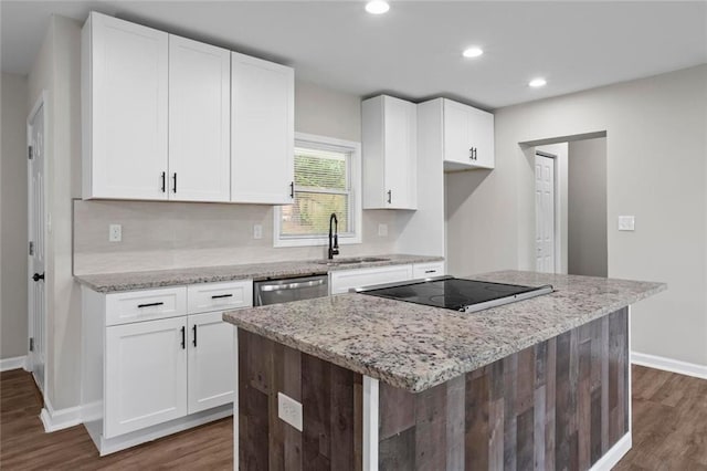 2478 Graywall St, East Point, GA 30344 - kitchen with a sink, dark wood finished floors, baseboards, white cabinets, and recessed lighting