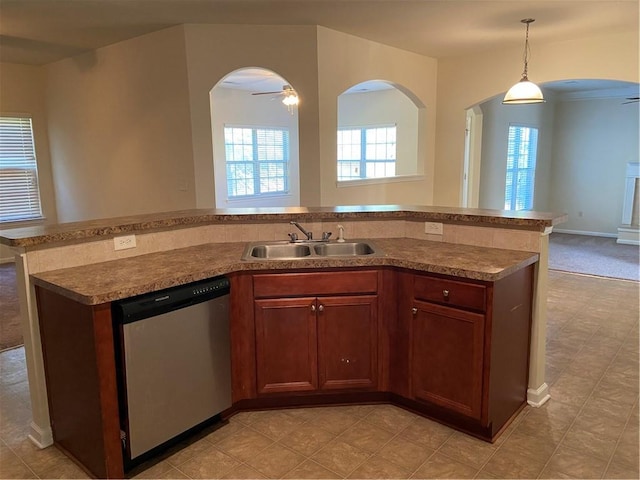 kitchen with stainless steel dishwasher, light tile patterned flooring, ceiling fan, hanging light fixtures, and sink