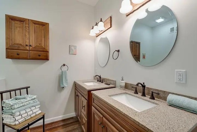 bathroom featuring vanity and hardwood / wood-style flooring