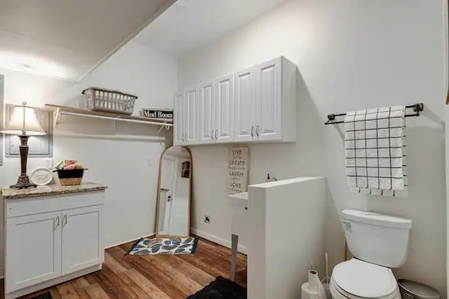 laundry area featuring light wood-type flooring