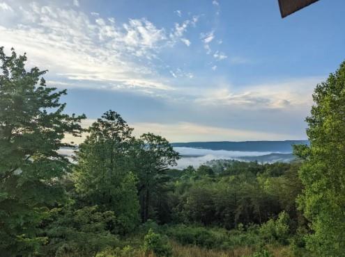 view of landscape with a water view