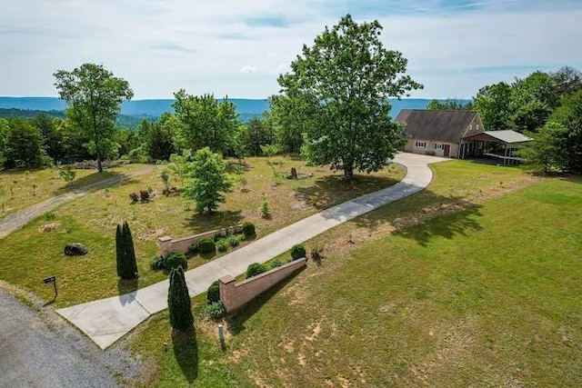 exterior space featuring a yard and a water view