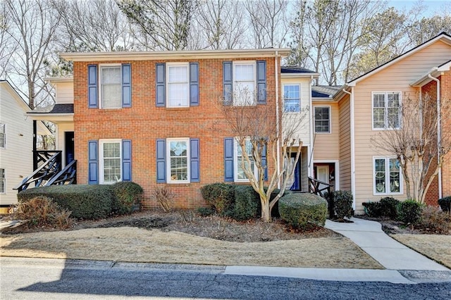 view of front of house with brick siding