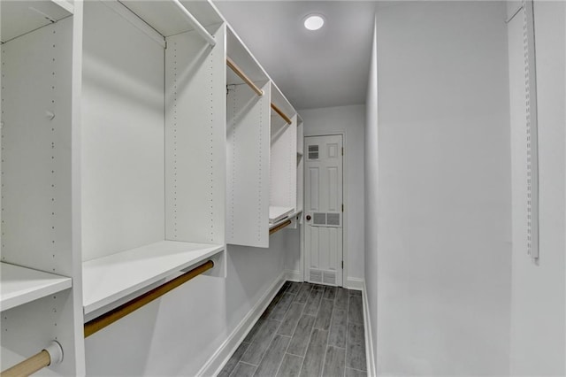 spacious closet with wood tiled floor