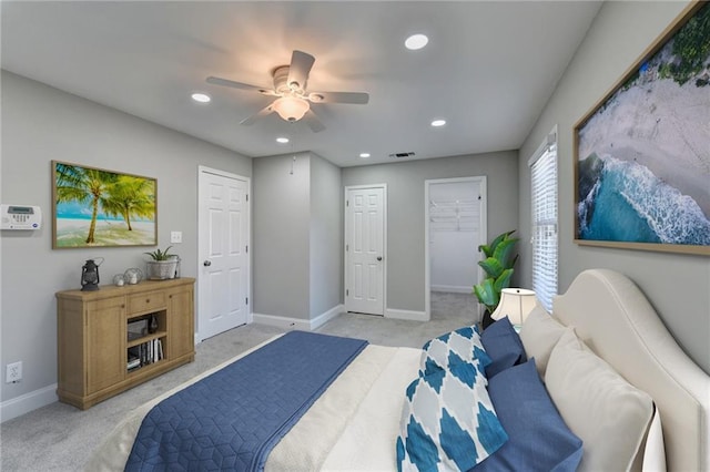 bedroom featuring light colored carpet, visible vents, and baseboards