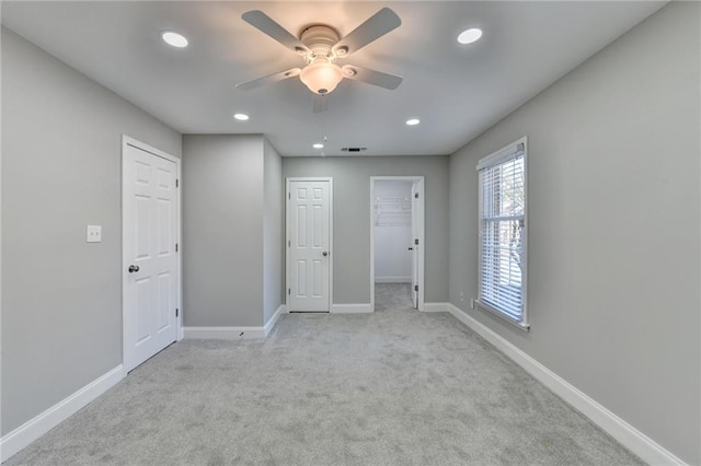 unfurnished bedroom with recessed lighting, visible vents, baseboards, and carpet