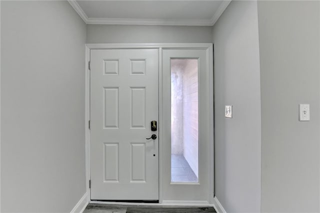 entrance foyer with baseboards, wood finished floors, and ornamental molding