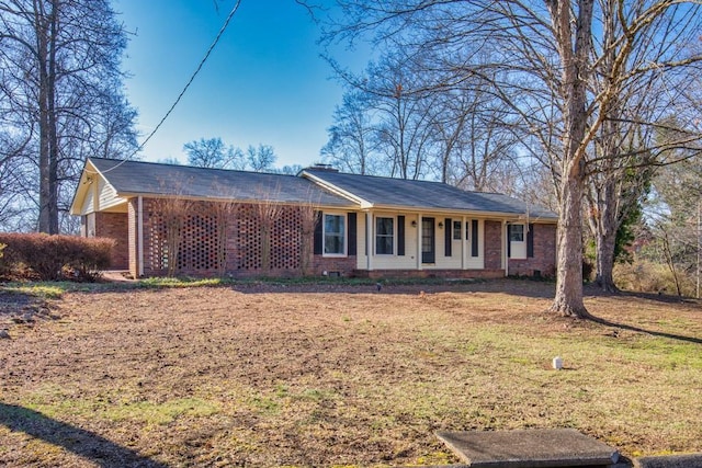 ranch-style house with a front lawn