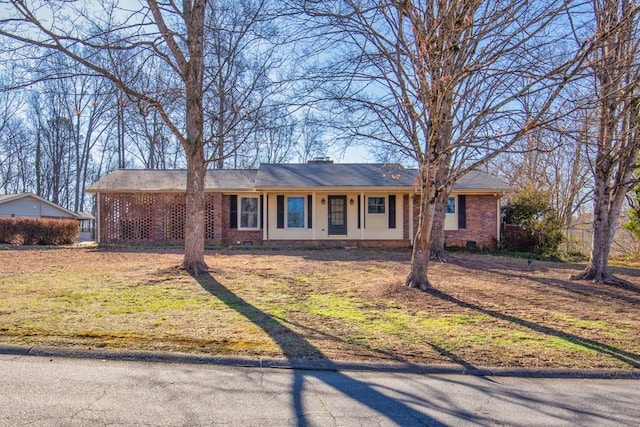 ranch-style house with a front lawn