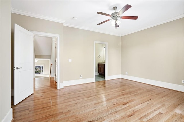 unfurnished bedroom with crown molding, baseboards, and light wood-style floors