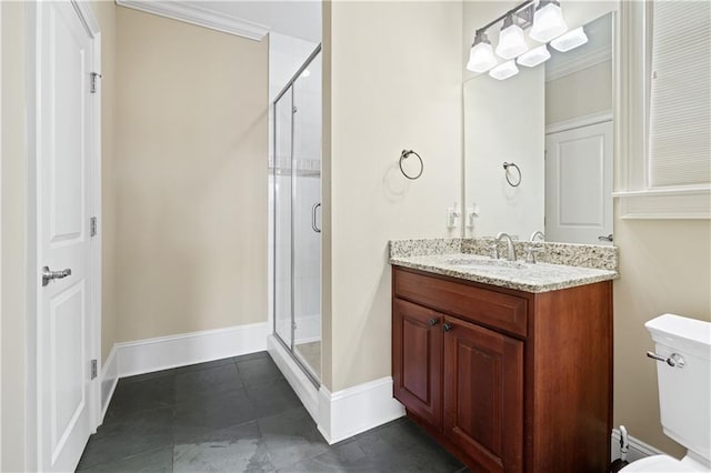 bathroom with toilet, a shower stall, and vanity