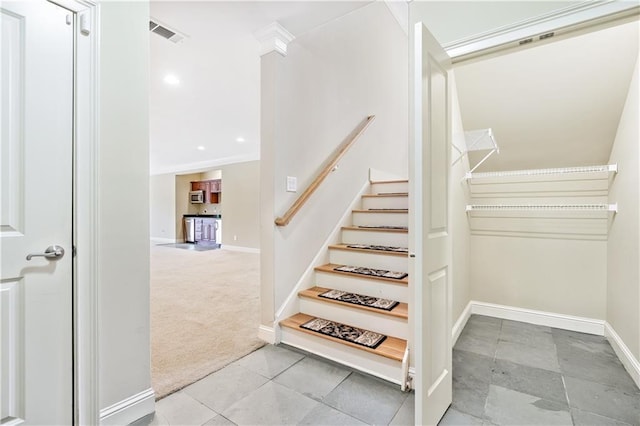 staircase featuring carpet floors, recessed lighting, visible vents, and baseboards