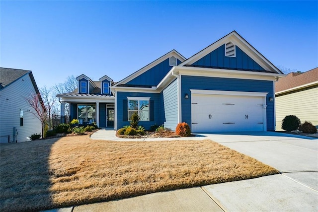 view of front of property with a garage and a front yard