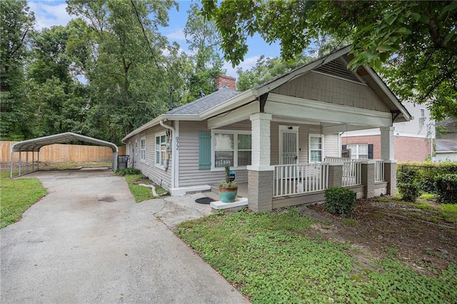 bungalow-style house featuring a carport and covered porch