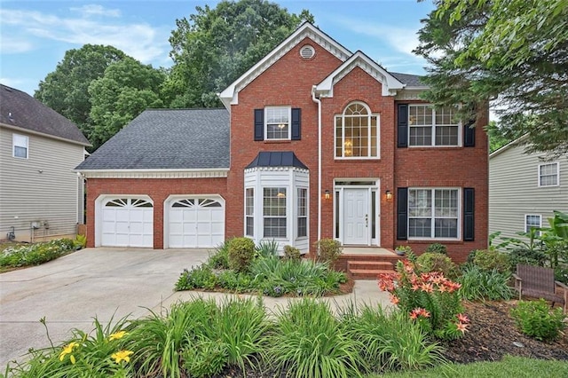 2018 Township Dr, Woodstock, GA 30189 - colonial inspired home featuring brick siding, a garage, and concrete driveway