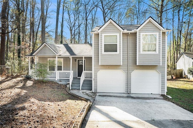 view of front of home with a porch and a garage