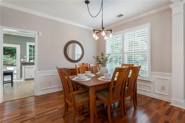 475 Chippenham Ct, Alpharetta, GA 30005 - dining room with a chandelier, wood finished floors, ornamental molding, a decorative wall, and a wainscoted wall
