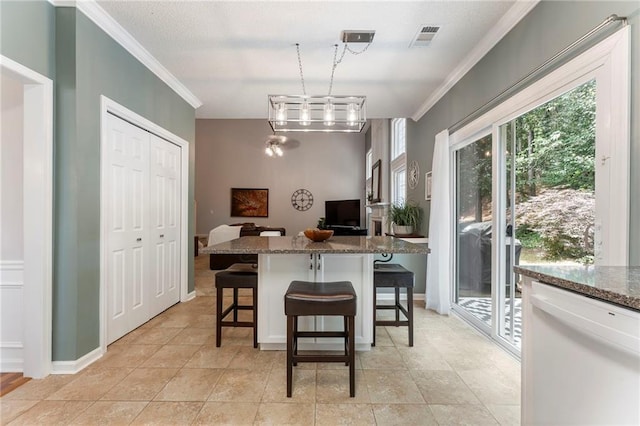 475 Chippenham Ct, Alpharetta, GA 30005 - kitchen with ornamental molding, dishwasher, a breakfast bar area, dark stone counters, and pendant lighting