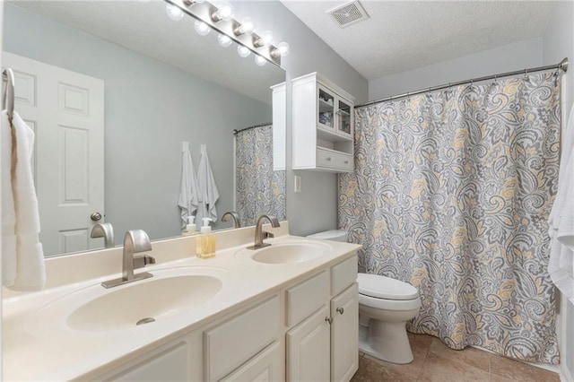 475 Chippenham Ct, Alpharetta, GA 30005 - full bathroom featuring double vanity, a textured ceiling, a shower with curtain, and tile patterned floors