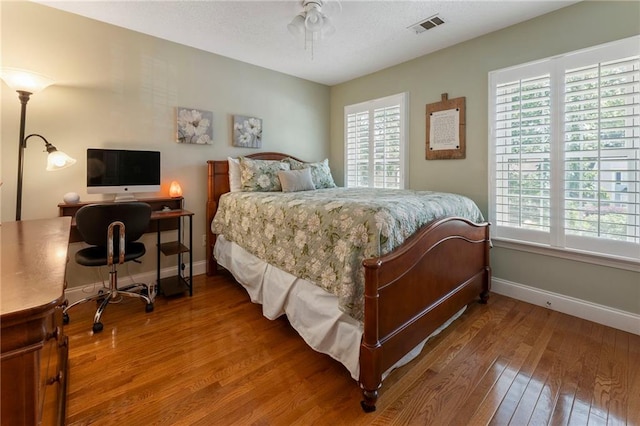 475 Chippenham Ct, Alpharetta, GA 30005 - bedroom featuring wood-type flooring, multiple windows, and an office area
