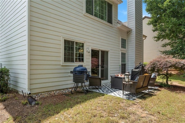 475 Chippenham Ct, Alpharetta, GA 30005 - rear view of house featuring a patio area, a chimney, and a lawn