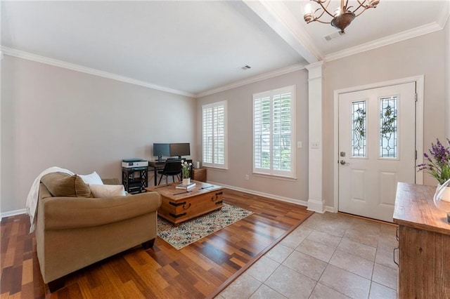 475 Chippenham Ct, Alpharetta, GA 30005 - living room featuring ornate columns, crown molding, a chandelier, and wood finished floors