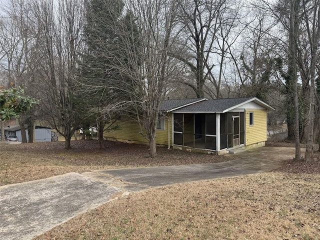 view of yard featuring a sunroom