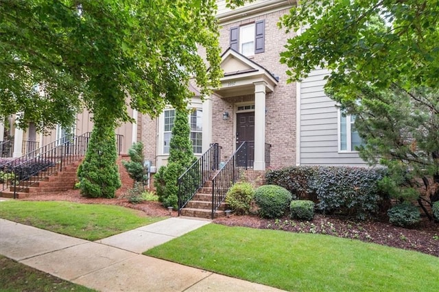 3937 Covey Flush Ct SW Unit 25, Smyrna, GA 30082 - view of front of home with a front lawn and brick siding